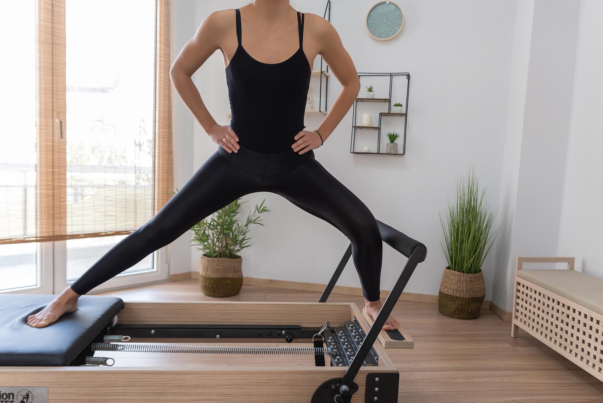 young-woman-exercising-on-pilates-reformer-bed-2021-08-26-15-59-35-utc-(5)